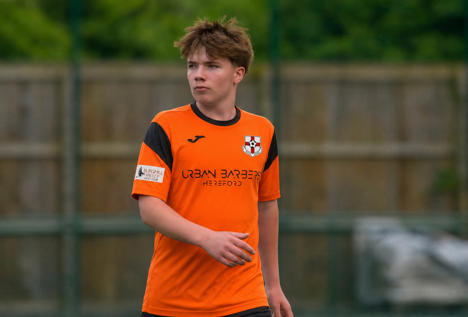 Zach Boardman in the Burghill Rangers orange home shirt during his debut against Ludlow