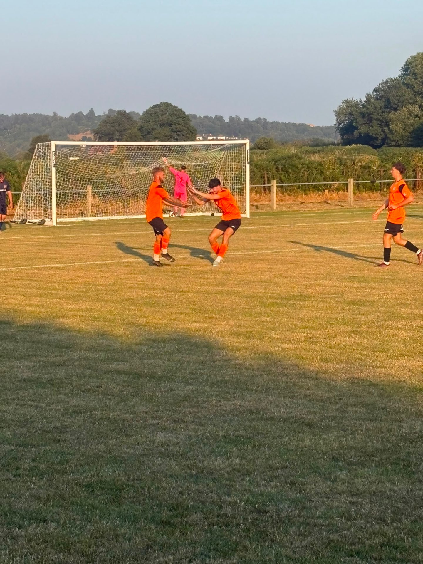 Burghill Rangers players celebrating on the pitch
