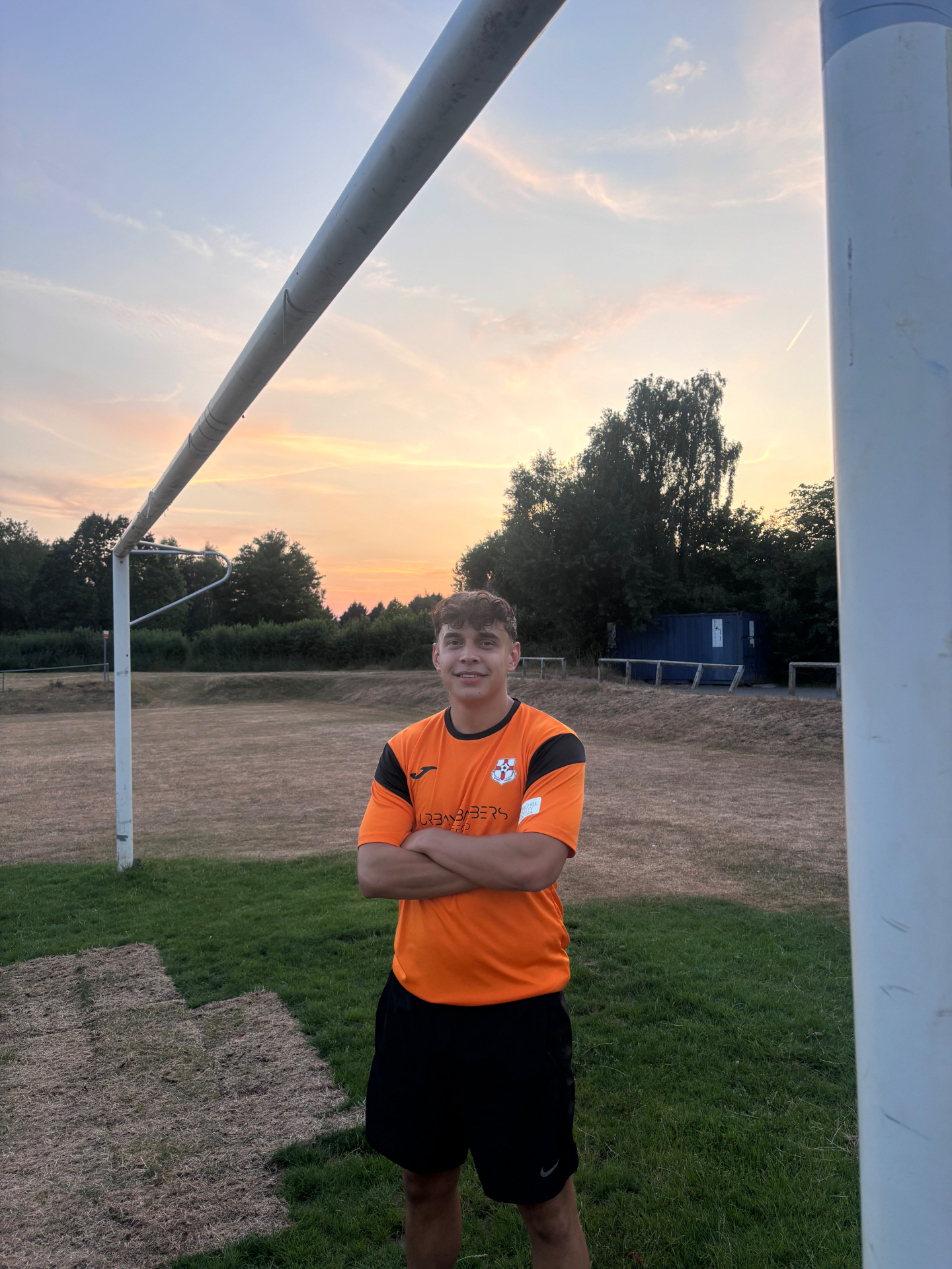 Jude Cook in the Burghill Rangers home shirt at The Copse at sunset